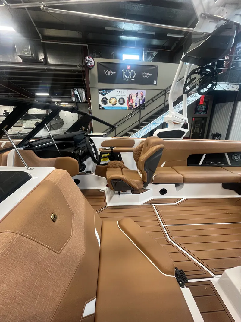 Slide: The Image of Interior of 2026 Nautique GS24 featuring luxurious seating and modern design. - 3