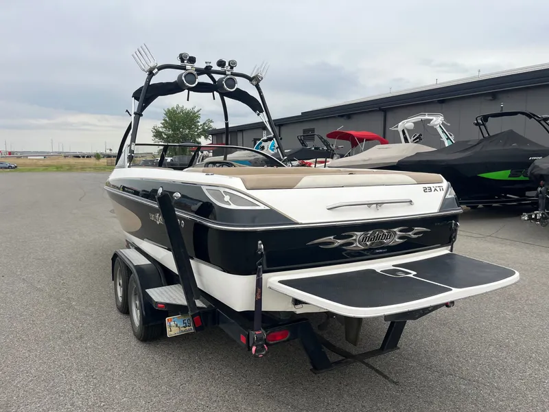 Slide: The Image of 2004 Malibu XTI boat on trailer, ready for watersports. - 5