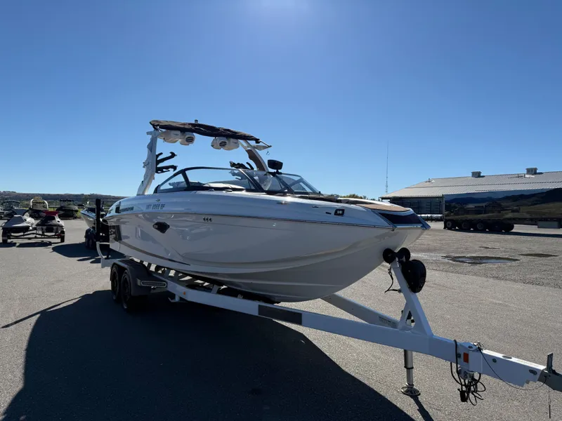 The Image of 2020 Centurion Ri237 boat on trailer under sunny skies. - 1