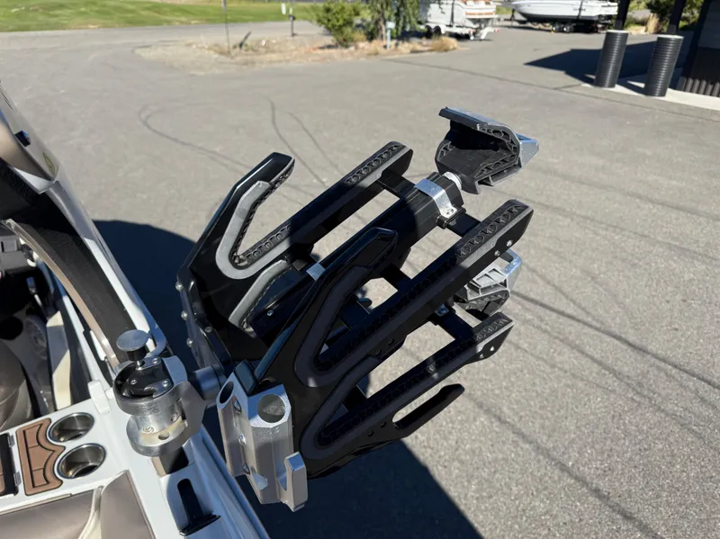 Slide: The Image of Centurion Ri237 2020 boat with wakeboard rack on parking lot. - 16