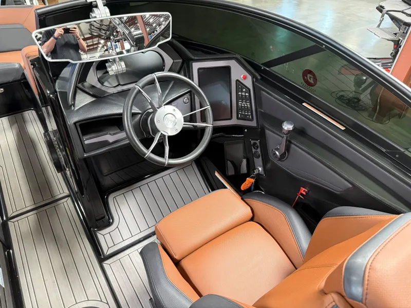 Slide: The Image of Interior of 2023 MasterCraft X STAR S boat with steering wheel and control console. - 10