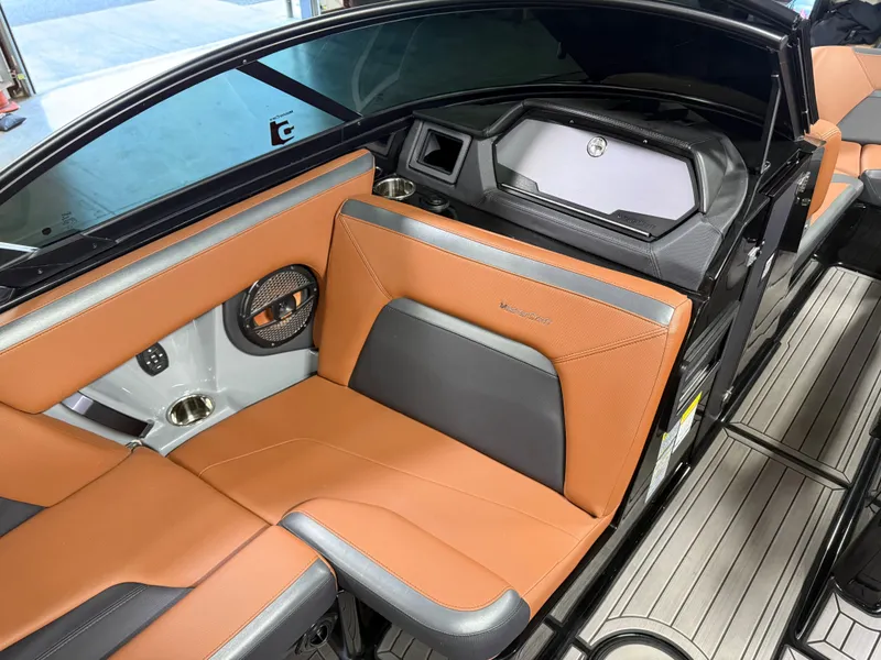 Slide: The Image of Interior of 2023 MasterCraft X STAR S with brown leather seats. - 11