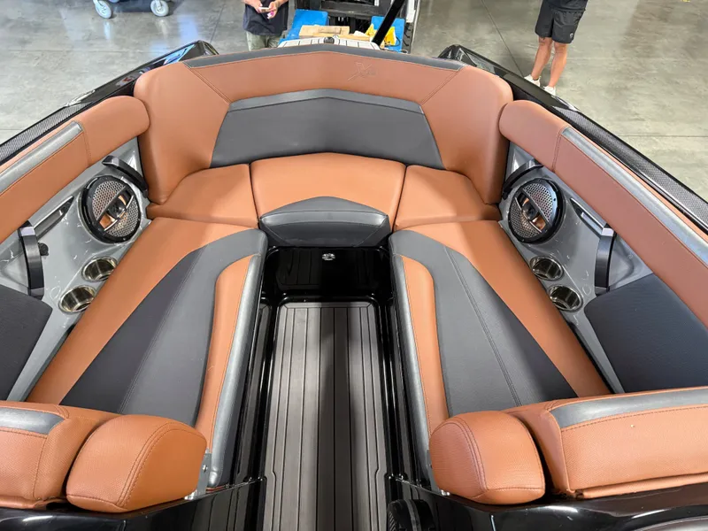 Slide: The Image of Interior of 2023 MasterCraft X STAR S with brown and gray seating. - 13