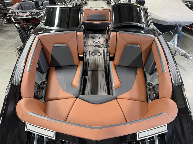 Slide: The Image of 2023 MasterCraft X STAR S interior with brown and gray seating. - 14
