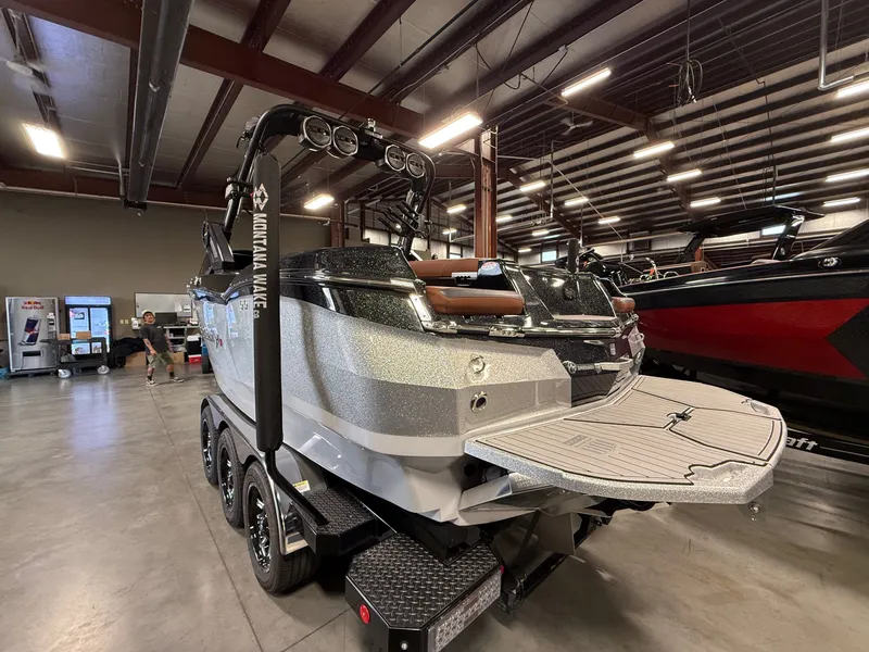 Slide: The Image of 2023 MasterCraft X STAR S boat in a warehouse. - 5