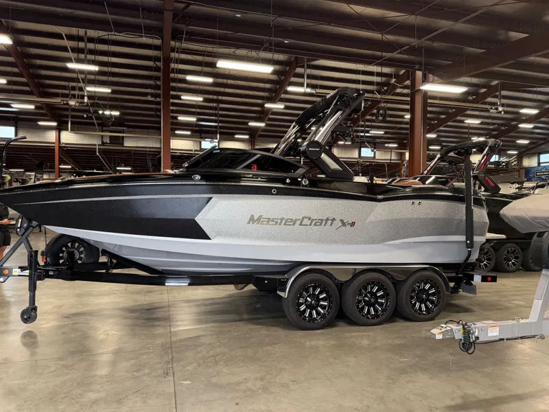 Slide: The Image of 2023 MasterCraft X STAR S boat in warehouse. - 6