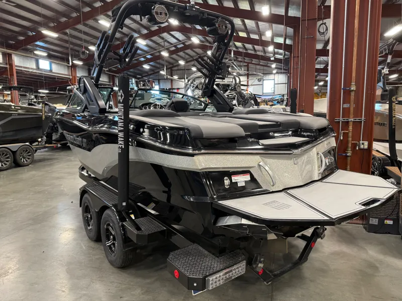 Slide: The Image of 2022 MasterCraft XT21 boat in a warehouse setting. - 3