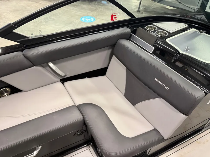 Slide: The Image of Interior of a 2022 MasterCraft XT21 boat with gray seating. - 8