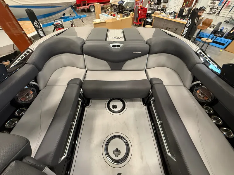Slide: The Image of Interior of a 2022 MasterCraft XT21 boat with gray upholstery. - 9