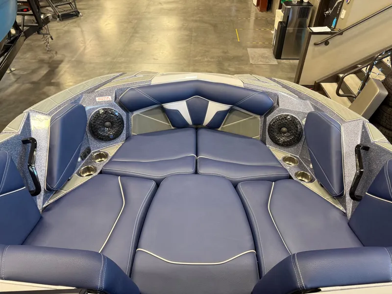 Slide: The Image of Interior of Centurion Fe23 boat, 2026, featuring blue upholstery and speakers. - 5