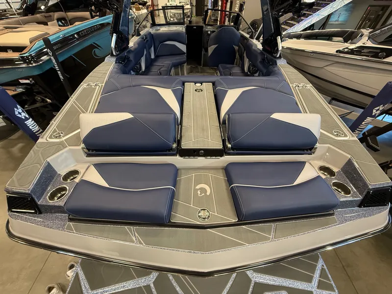 Slide: The Image of 2026 Centurion Fe23 boat with luxurious blue seating and modern design. - 7