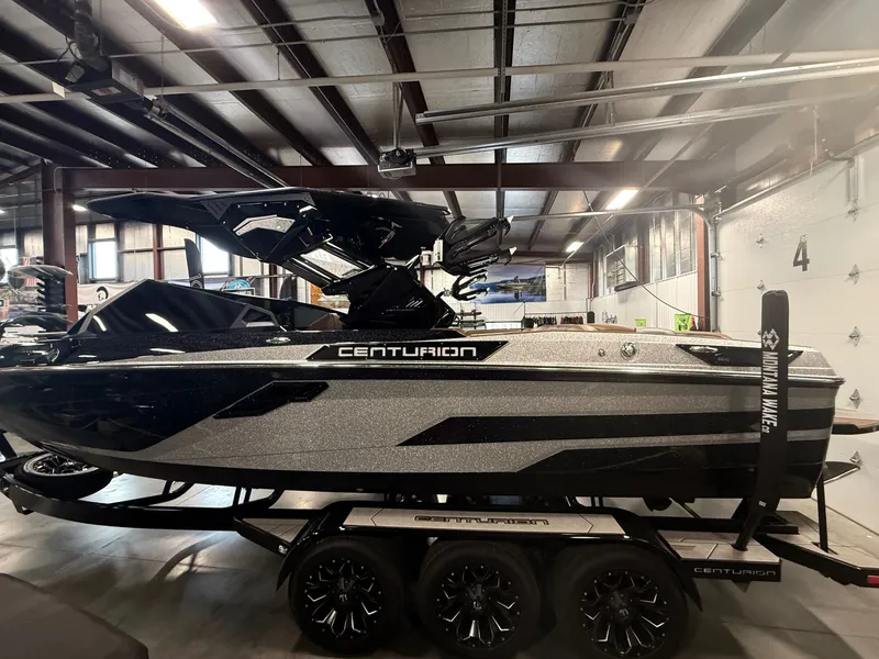 Slide: The Image of 2025 Centurion Ri245 boat in a warehouse setting. - 3