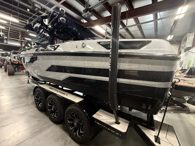 Slide: The Image of 2025 Centurion Ri245 boat in warehouse, sleek and shiny design. - 5