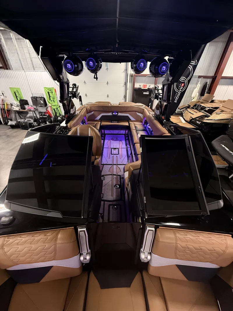 Slide: The Image of Interior of 2025 Centurion Ri245 with luxurious seating and lighting. - 8