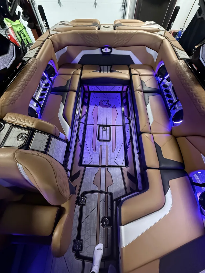 Slide: The Image of Interior of 2025 Centurion Ri245 with luxurious seating and blue lighting. - 9