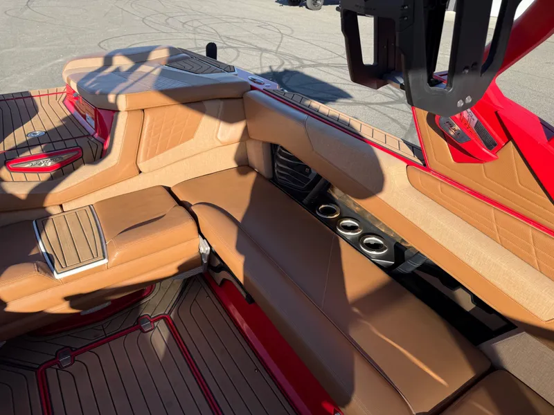 Slide: The Image of Interior of a 2021 Nautique G25 with brown leather seats. - 15