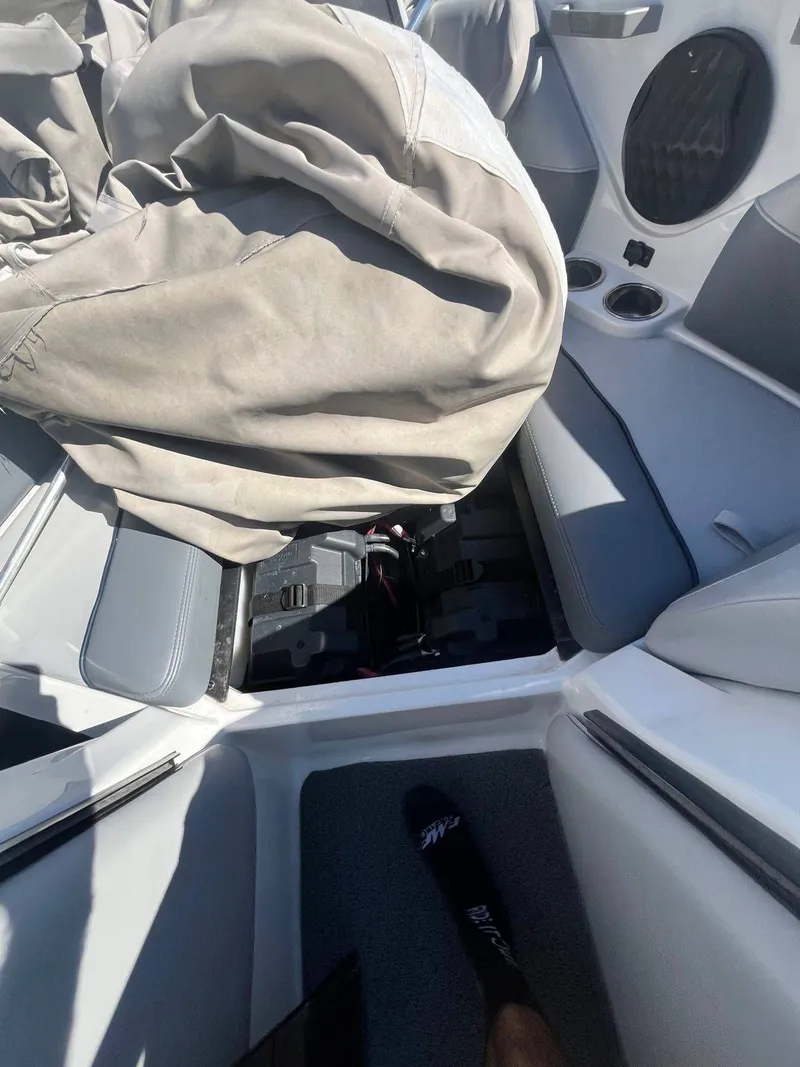 Slide: The Image of Interior of a 2022 Malibu Wakesetter 22 LSV boat with cover. - 12