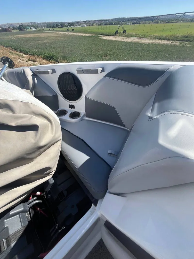 Slide: The Image of Interior of 2022 Malibu Wakesetter 22 LSV with gray seating. - 17