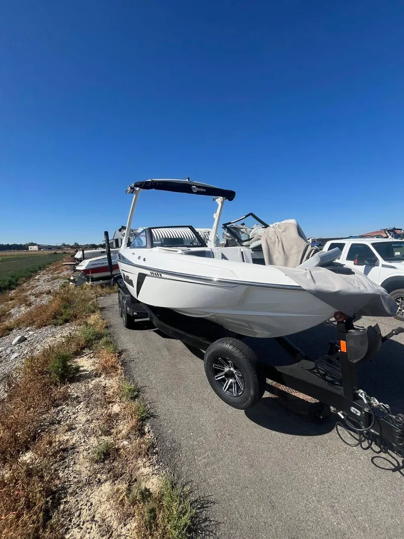 Slide: The Image of 2022 Malibu Wakesetter 22 LSV boat on trailer, sunny day. - 20