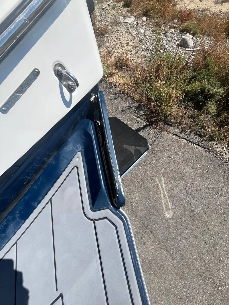 Slide: The Image of Malibu Wakesetter 22 LSV 2022 boat rear on asphalt. - 23