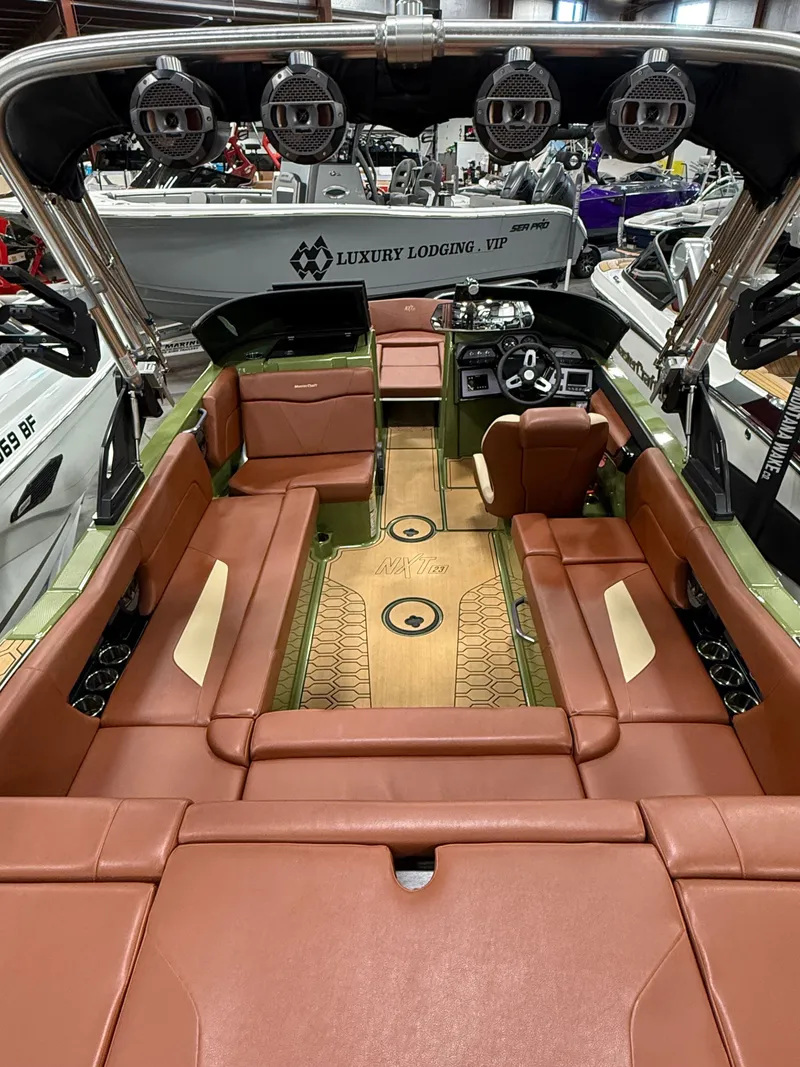 Slide: The Image of Interior of 2025 MasterCraft NXT23 with luxurious leather seating. - 3