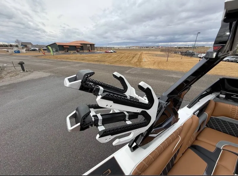 Slide: The Image of 2026 Centurion Ri 265 boat with modern design and features. - 13