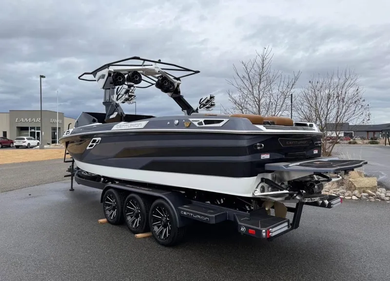 Slide: The Image of 2026 Centurion Ri 265 boat on trailer, overcast sky. - 3