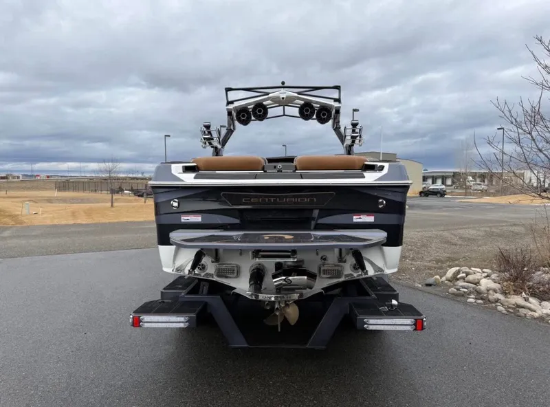 Slide: The Image of Rear view of 2026 Centurion Ri 265 boat parked on asphalt. - 5