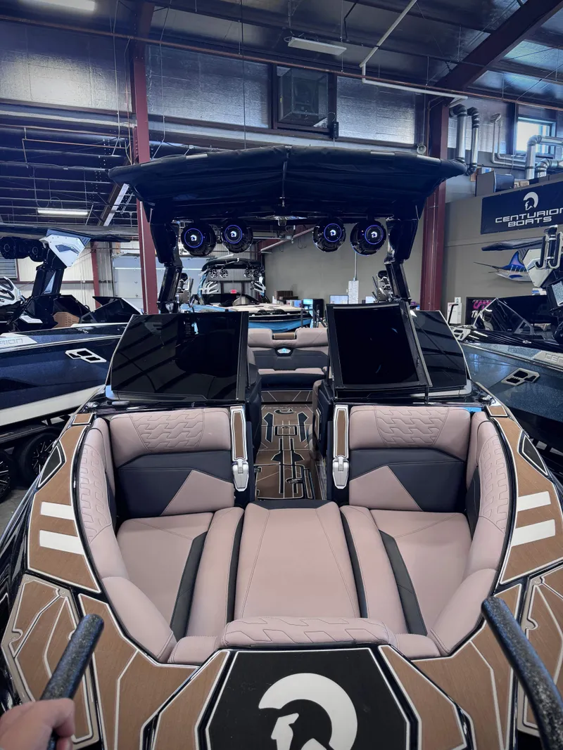 Slide: The Image of Interior view of 2026 Centurion Ri245 boat in a showroom. - 16