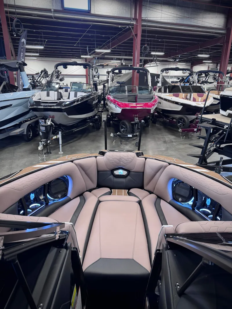 Slide: The Image of Interior view of a 2026 Centurion Ri245 boat in a warehouse. - 19