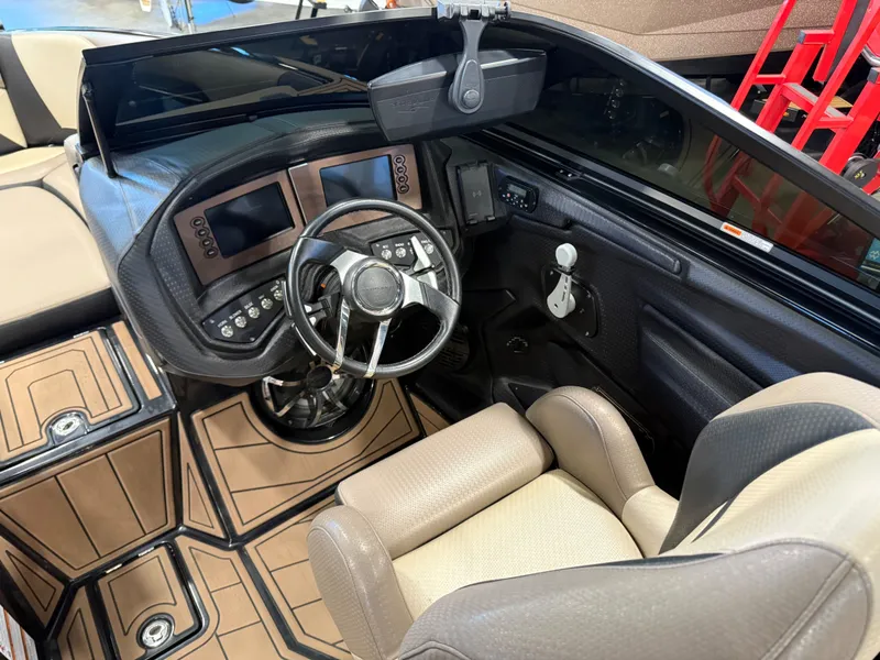 Slide: The Image of Interior of a 2020 Centurion Ri257 boat with modern helm console. - 10