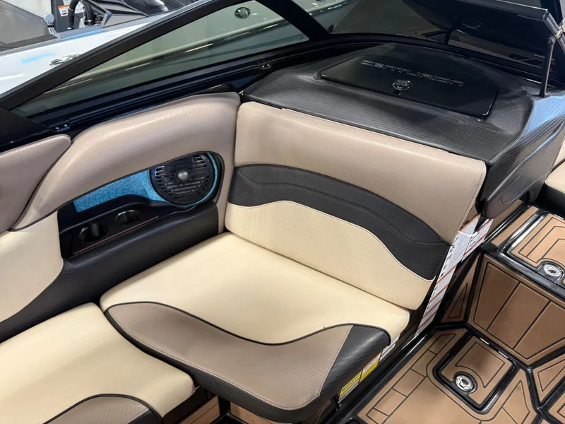 Slide: The Image of Interior of a 2020 Centurion Ri257 boat with beige and black seating. - 11