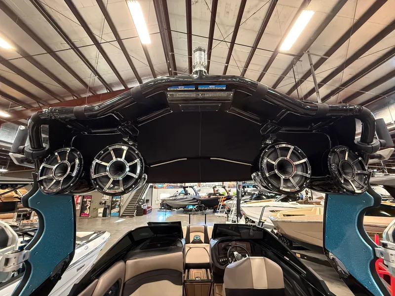 Slide: The Image of Interior view of a 2020 Centurion Ri257 boat with speakers. - 13