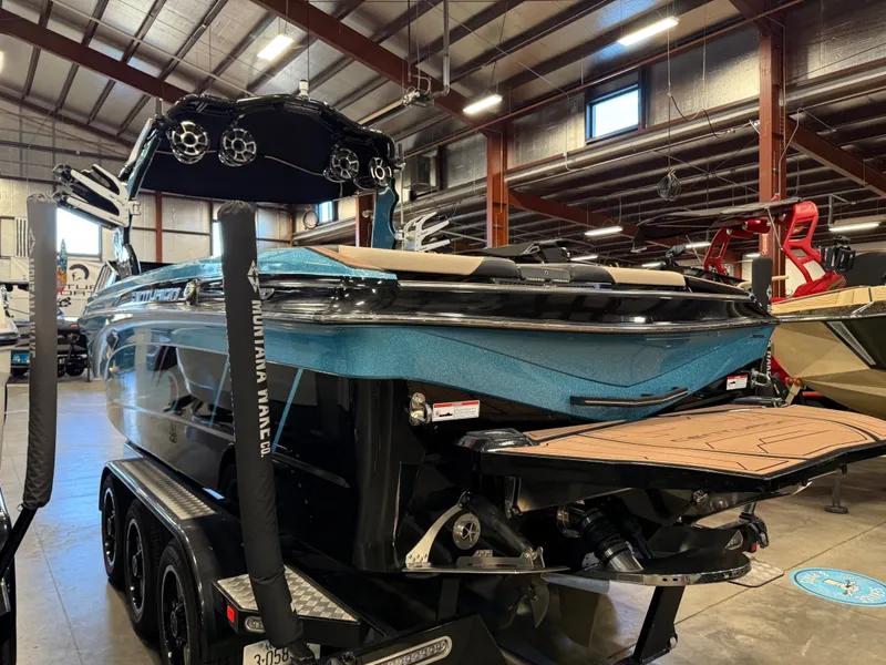 Slide: The Image of 2020 Centurion Ri257 boat in a warehouse, rear view. - 4