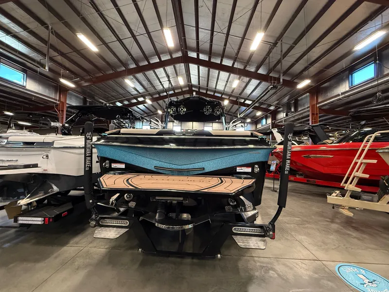 Slide: The Image of 2020 Centurion Ri257 boat displayed in a warehouse setting. - 5