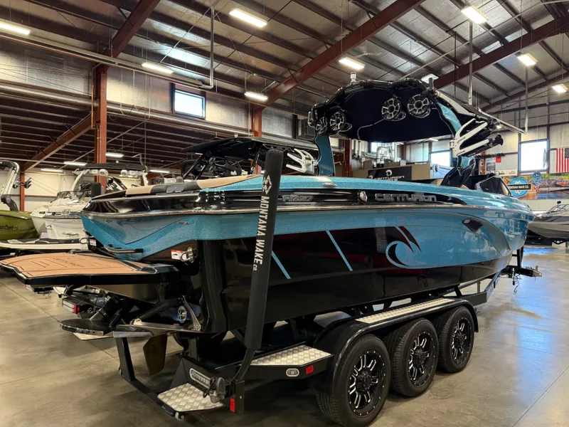Slide: The Image of 2020 Centurion Ri257 boat displayed in a warehouse. - 6