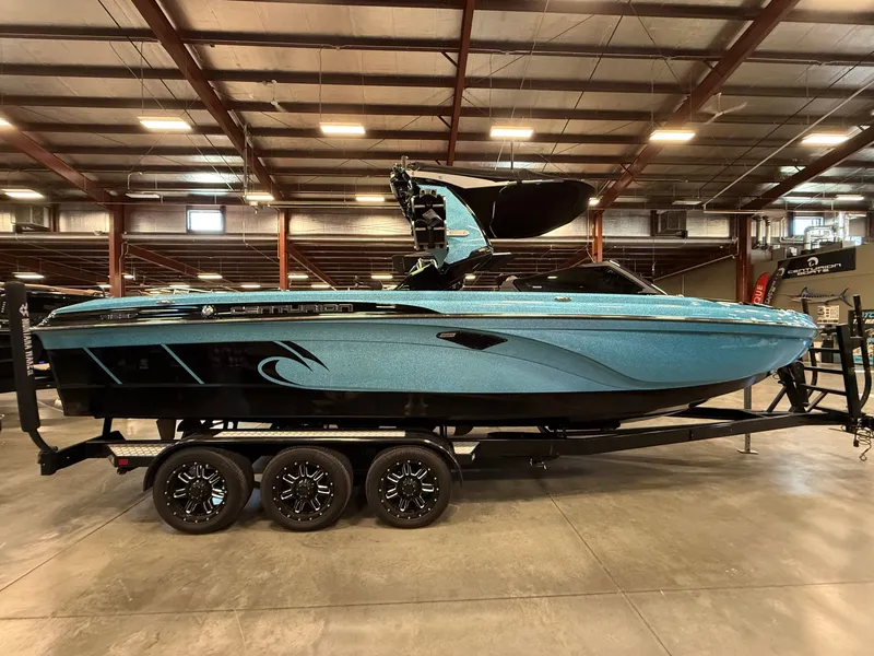 Slide: The Image of 2020 Centurion Ri257 boat displayed in a warehouse. - 7