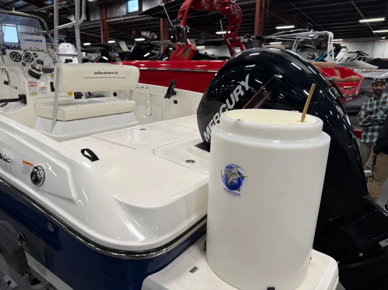 Slide: The Image of 2018 Bayliner Element F21 boat with Mercury engine in showroom. - 13