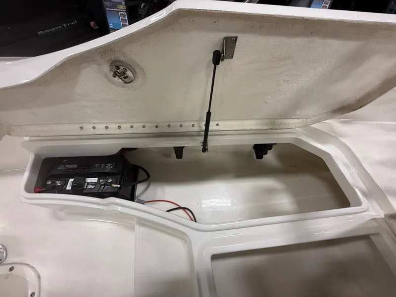 Slide: The Image of Battery compartment of 2018 Bayliner Element F21 boat. - 21