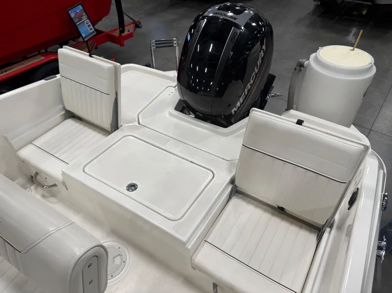 Slide: The Image of Interior view of a 2018 Bayliner Element F21 boat with Mercury engine. - 22