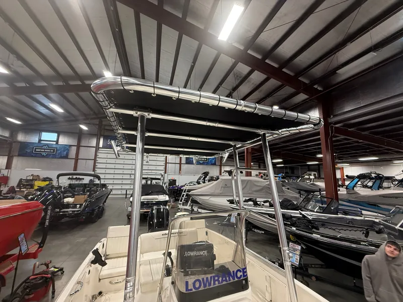 Slide: The Image of 2018 Bayliner Element F21 boat in showroom. - 5
