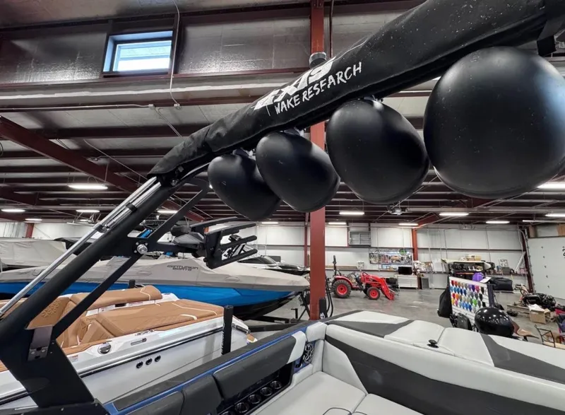 Slide: The Image of 2021 Axis A24 boat with wakeboard tower in warehouse. - 8