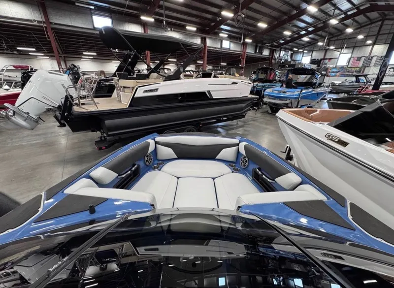 Slide: The Image of Interior view of a 2021 Axis A24 boat in a showroom. - 9