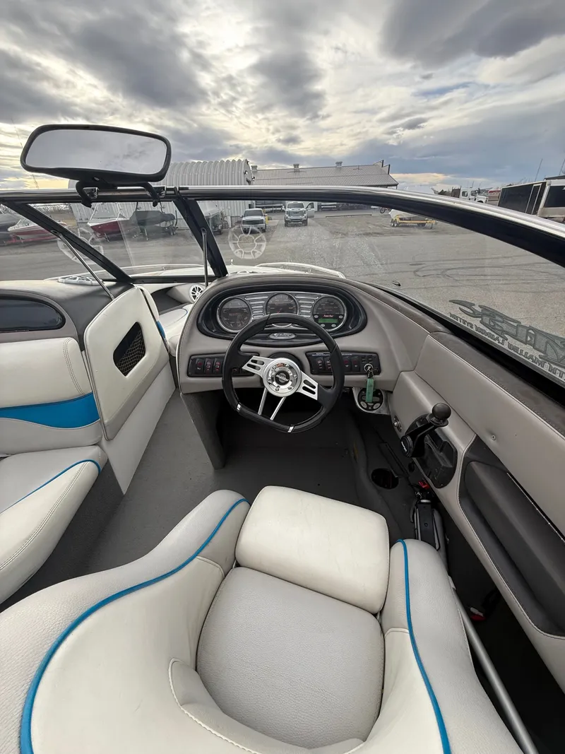 Slide: The Image of Interior of a 2005 Malibu Wakesetter VLX boat with steering console. - 7