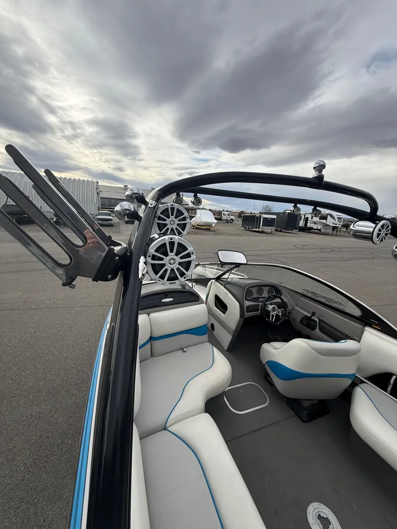 Slide: The Image of Interior of a 2005 Malibu Wakesetter VLX with speakers and seating. - 8