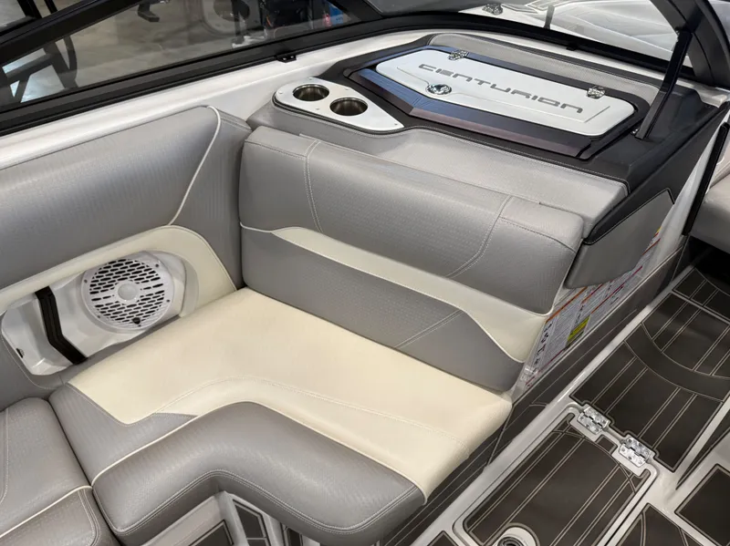 Slide: The Image of Interior of 2023 Centurion Ri230 boat with gray and white seating. - 11