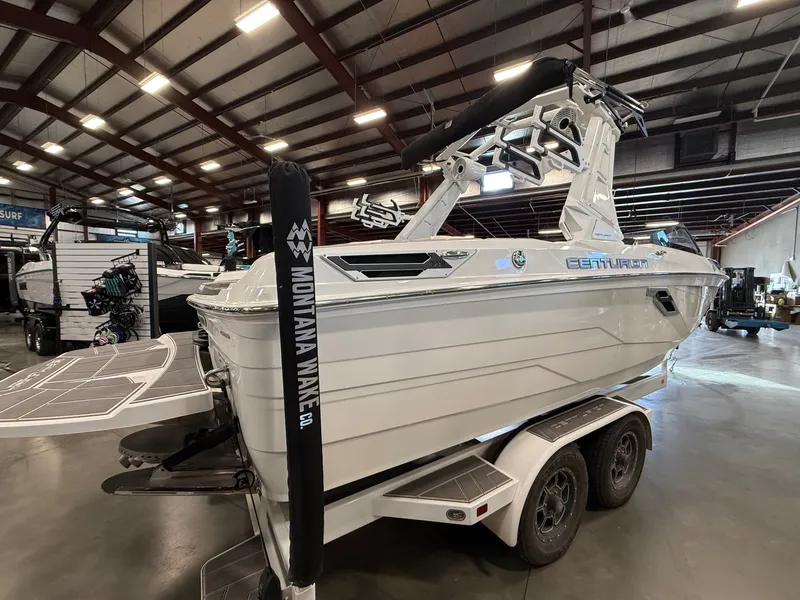 Slide: The Image of 2023 Centurion Ri230 boat in a warehouse on a trailer. - 3