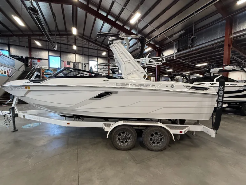 Slide: The Image of 2023 Centurion Ri230 boat on trailer in warehouse. - 6