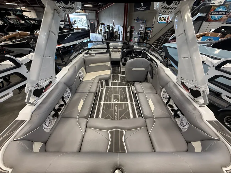 Slide: The Image of Interior of 2023 Centurion Ri230 boat with gray leather seating. - 9
