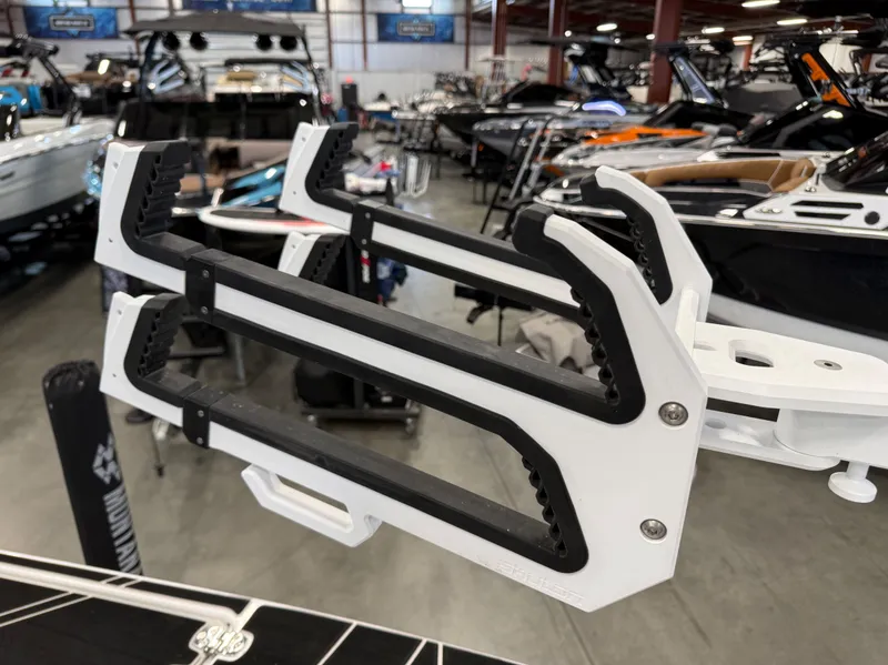 Slide: The Image of Centurion Fi23 2024 boat with wakeboard rack in showroom. - 13